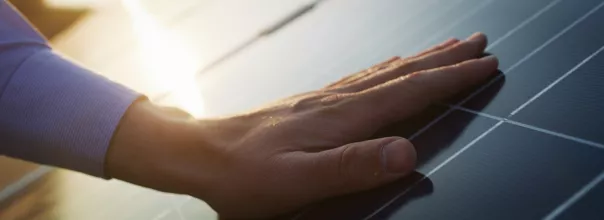 hand and solar panel
